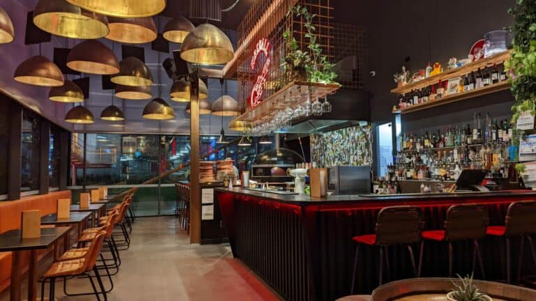 Modern Australian bar interior with eclectic lighting.