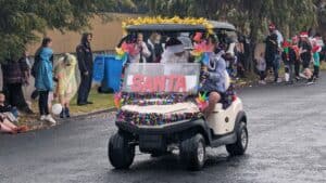 Christmas parade with decorated golf cart in Australia