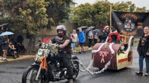 Christmas motorcycle parade in rainy Australia.