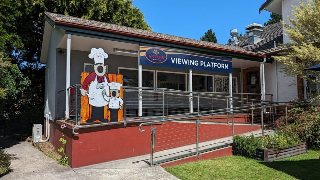 Chocolate shop exterior with cartoon chef mural in Tasmania.