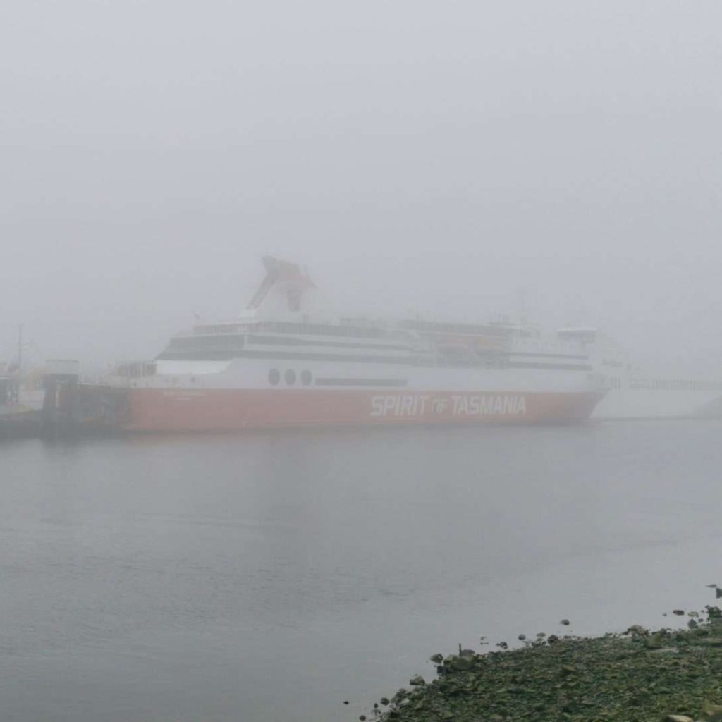 Spirit of Tasmania ferry in foggy port.