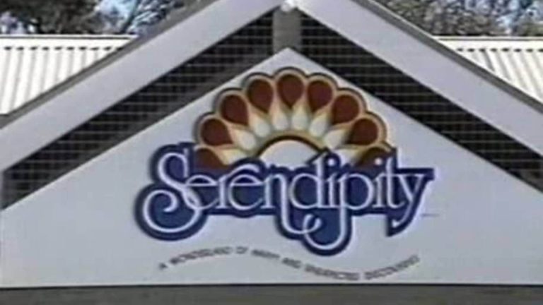 Serendipity sign on building facade.